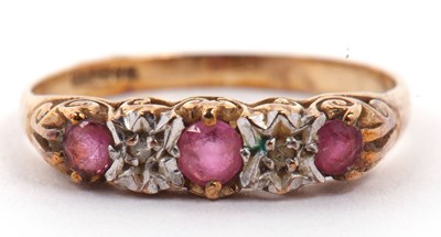 Lot 19 - 9ct gold ruby and diamond ring featuring three...