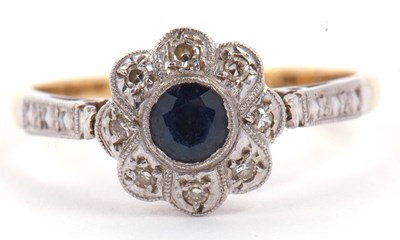 Lot 23 - Sapphire and diamond flower head ring...