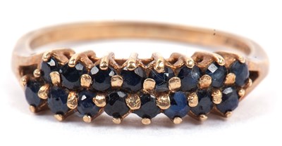 Lot 24 - 9ct gold and sapphire ring, a design with two...