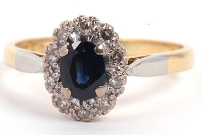 Lot 26 - 18ct stamped blue stone and diamond cluster...