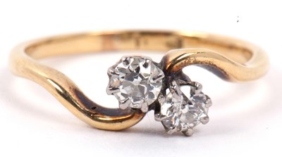 Lot 30 - A two stone diamond crossover ring featuring...