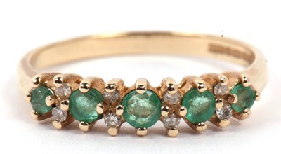 Lot 37 - 9ct gold emerald and diamond half eternity...