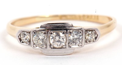 Lot 40 - An Art Deco five stone diamond ring featuring...