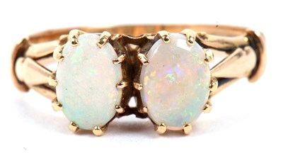 Lot 53 - Opal two stone ring featuring two oval...