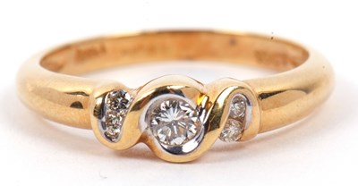 Lot 79 - A three stone diamond ring, the bezel set...