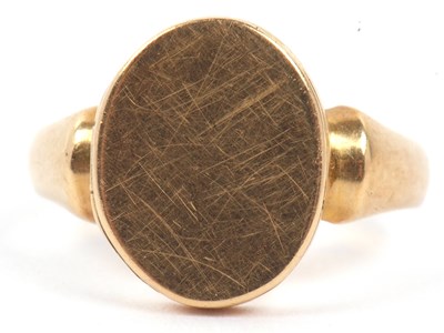 Lot 84 - An antique 18ct gold locket ring, the plain...