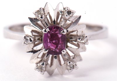 Lot 97 - A modern 18ct white gold diamond and red stone...