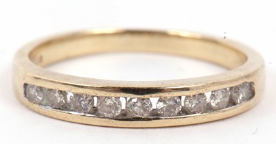 Lot 102 - A modern 9ct gold and diamond half eternity...