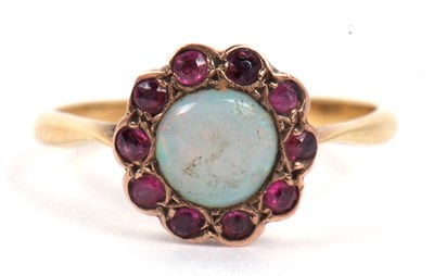 Lot 108 - An opal and amethyst ring, the cabochon round...