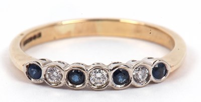 Lot 110 - A 9ct gold sapphire and diamond half eternity...