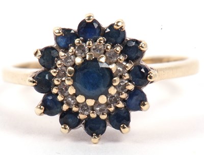 Lot 112 - A modern 9ct gold sapphire and diamond cluster...