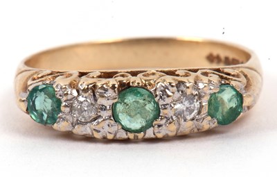 Lot 127 - A 9ct gold emerald and diamond ring featuring...