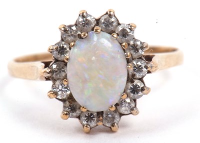 Lot 128 - A 9ct gold opalescent and white stone cluster...