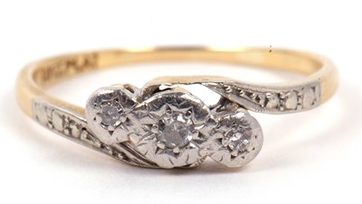 Lot 130 - A three stone diamond ring featuring three...