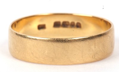 Lot 145 - An 18ct gold wedding ring of plain polished...