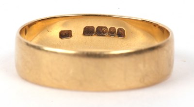 Lot 145 - An 18ct gold wedding ring of plain polished...