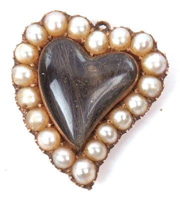 Lot 200 - An antique heart shaped mourning pendant, the...