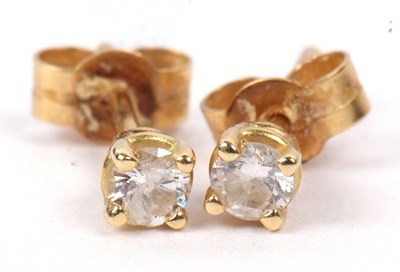 Lot 208 - A small pair of diamond stud earrings in...