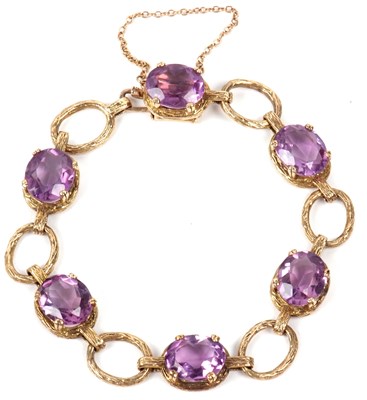 Lot 223 - A 9ct stamped amethyst bracelet, a design...