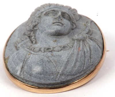 Lot 238 - A hardstone cameo brooch carved in relief...