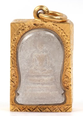 Lot 246 - A carved stone religious pendant depicting a...