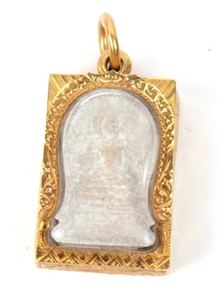 Lot 246 - A carved stone religious pendant depicting a...