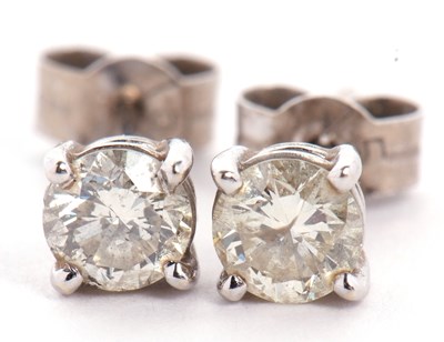 Lot 258 - A pair of diamond stud earrings, round...