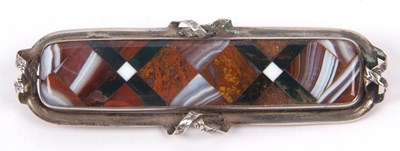 Lot 272 - An antique banded agate elongated brooch in a...