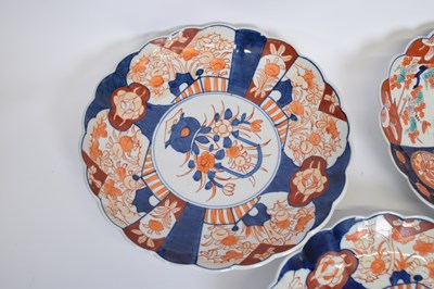 Lot 24 - Four Japanese porcelain Imari style dishes...