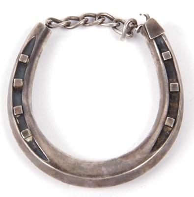 Lot 294A - A white metal horseshoe bracelet, 7 x 6.5 cm,...