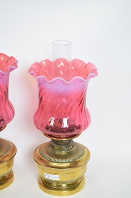 Lot 38 - Pair of oil lamps with red vaseline type...