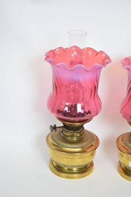 Lot 38 - Pair of oil lamps with red vaseline type...