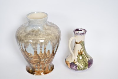 Lot 57 - Cobridge stoneware ewer decorated with plums...