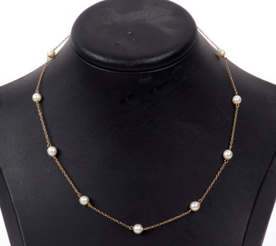 Lot 215 - A pearl set necklace, a yellow metal chain...