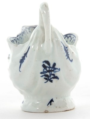 Lot 115 - Lowestoft porcelain dolphin ewer with blue and...