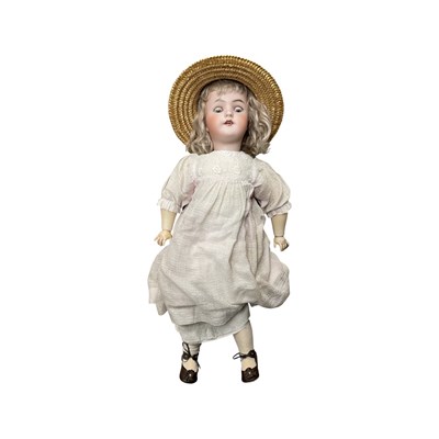 Lot 303 - A German bisque head doll in floral linen...