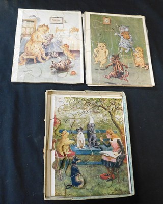 Lot 641 - Two vintage Louis Wain jigsaw puzzles on card...