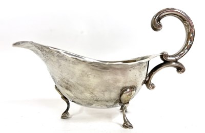 Lot 2 - Silver sauce boat of typical form, card cut...