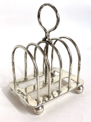 Lot 5 - An Edwardian silver toast rack of four...