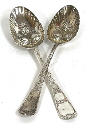 Lot 7 - A pair of George III silver berry spoons,...