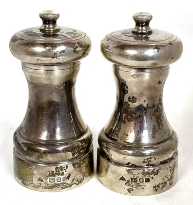 Lot 11 - Two Elizabeth II silver cased capston pepper...