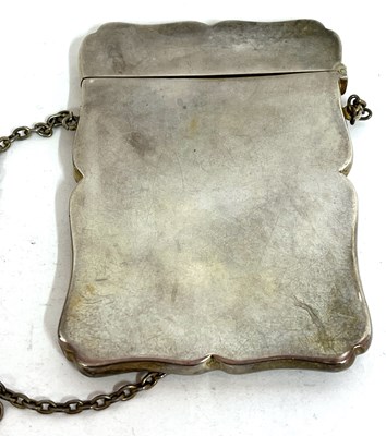 Lot 50 - A George V silver card case with wavey edges,...