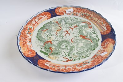 Lot 342 - A large Japanese porcelain charger with...
