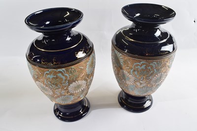 Lot 365 - A pair of Royal Doulton vases, the central...