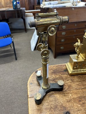 Lot 527 - A antique brass adjustable level or microscope,...
