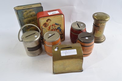 Lot 402 - A collection of various vintage tin money...