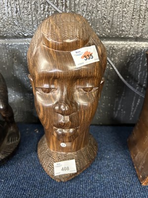 Lot 408 - Two carved African busts, one in a black ebony...