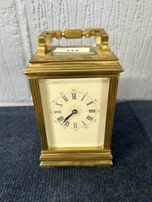 Lot 414 - A 20th Century carriage clock with key