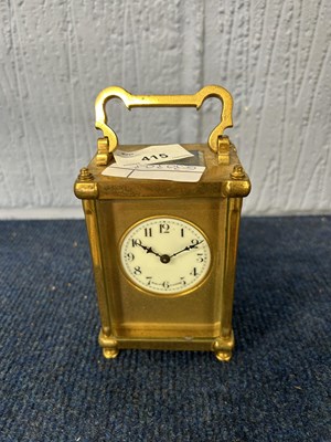 Lot 415 - Small carriage clock with key, the dial signed...
