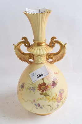 Lot 486 - A Royal Worcester blush ground vase decorated...